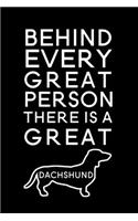 Behind every great person there is a great dachshund