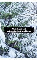 Notizbuch mit schneebedeckten Baum