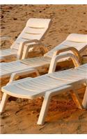 Three White Lounge Chairs on the Beach in Florida Journal