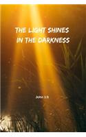 The light shines in the darkness - John 1: 5: Notebook Cover with Bible Verse to use as Notebook - Planner - Journal - 120 pages blank lined - 6x9 inches (A5)