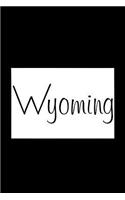 Wyoming - Black Lined Notebook with Margins: 101 Pages, Medium Ruled, 6 x 9 Journal, Soft Cover
