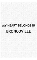 My Heart Belongs in Broncoville: A 6x9 Inch Matte Softcover Journal Notebook with 120 Blank Lined Pages and a Positive Hometown or Travel Cover Slogan