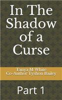 In The Shadow of a Curse