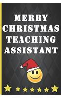 Merry Christmas Teaching Assistant: Cute emoji notebook to write in with blank lined pages. Fab Teaching Assistant Christmas gift - they love notebooks!