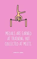 Medals are earned at training, but collected at meets.