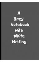 A Grey Notebook with White Writing