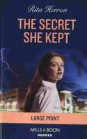 The Secret She Kept