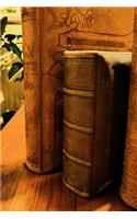 Leather-Bound Antique Books on a Shelf Journal