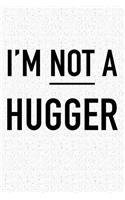 I'm Not a Hugger: A 6x9 Inch Matte Softcover Notebook Journal with 120 Blank Lined Pages and a Funny Cover Slogan