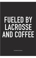 Fueled By Lacrosse And Coffee: A 6x9 Inch Matte Softcover Diary Notebook With 120 Blank Lined Pages And A Funny Field Sports Fanatic Cover Slogan