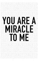 You Are a Miracle to Me: A 6x9 Inch Matte Softcover Journal Notebook with 120 Blank Lined Pages and an Uplifting Positive and Motivaitonal Cover Slogan