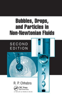 Bubbles, Drops, and Particles in Non-Newtonian Fluids