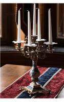 Decorative Candelabra and Candle on a Table with Runner Journal