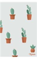 Notes: Cactus plants on the cover of a blank lined notebook