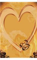 Wedding Rings on a Heart Journal
