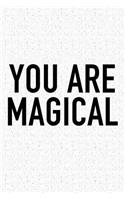You Are Magical: A 6x9 Inch Matte Softcover Journal Notebook with 120 Blank Lined Pages and an Uplifting Positive and Motivaitonal Cover Slogan