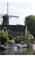 A Beautiful Windmill on the Water in Holland