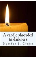 candle shrouded in darkness