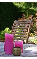 Hot Pink Candles on a Wooden Table in the Garden Outdoor Living Journal