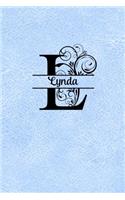 Split Letter Personalized Name Journal - Lynda: Elegant Flourish Capital Letter on Light Blue Leather Look Background