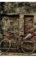 Bicycle Against A Brick Wall - Lined Notebook
