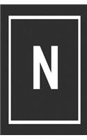 N: Black and white border initial notebook jotter