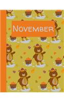 November: Monthly Notebook / Wide Ruled Lined / Journal A Month / Bear Pulling Wagon with Pumpkins and Leaves