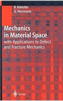 Mechanics in Material Space