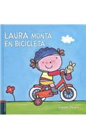 Laura monta en bicicleta