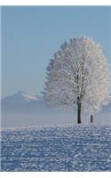 A Solitary Tree in a Snow Covered Field Winter Landscape Journal: 150 Page Lined Notebook/Diary