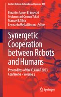 Synergetic Cooperation Between Robots and Humans