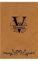 Split Letter Personalized Name Journal - Veronica: Elegant Flourish Capital Letter on LT Brown Leather Look Background