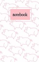 White and pink pig print notebook