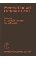 Swarms of Ions and Electrons in Gases