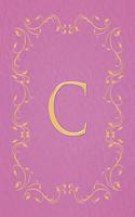 C: Modern, stylish, capital letter monogram ruled composition notebook with gold leaf decorative border and baby pink leather effect. Pretty with a des