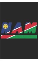 Nam: Namibia Notizbuch mit blanko 120 Seiten in weiß. Notizheft mit der namibischen Flagge