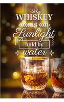 Whiskey is sunlight hold by water: Tasting notebook. A gift for whiskey / whisky lovers.