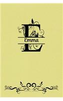 Split Letter Personalized Name Journal - Emma: Elegant Flourish Capital Letter on Light Yellow Leather Look Background