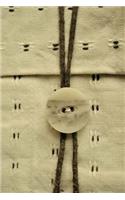 A Charming Handcrafted Button and Twine Closure Image on a Blank/Lined Journal