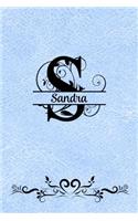 Split Letter Personalized Name Journal - Sandra: Elegant Flourish Capital Letter on Light Blue Leather Look Background