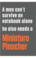 A man can't survive on notebook alone he also needs a Miniature Pinscher