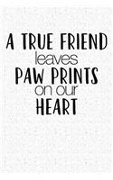 A True Friend Leaves Paw Prints on Your Heart: A 6x9 Matte Softcover Notebook Journal with 120 Blank Lined Pages and an Animal Loving Pet Dog Owner Cover Slogan