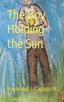 The Boy Holding the Sun
